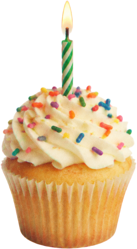 Floating birthday cupcake with a lit candle and a warm vintage film treatment